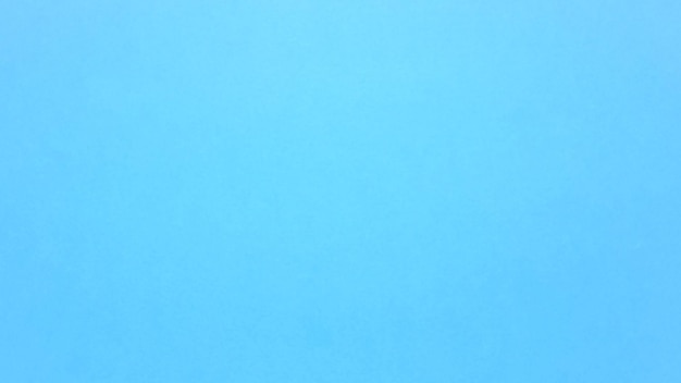 Bright vivid blue background. Beautiful blue or sky blue