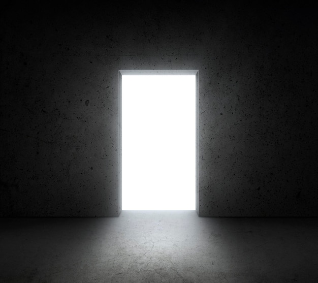 Bright white light shines from door in dark room Dream success