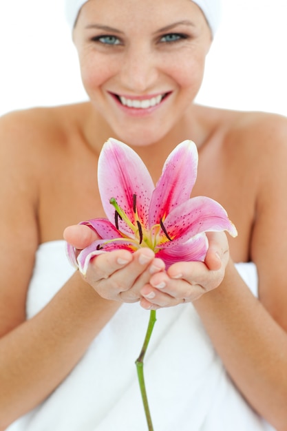 Bright woman holding a flower 