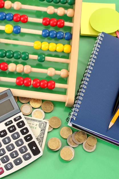 Photo bright wooden abacus and calculator conceptual photo of old and modern business