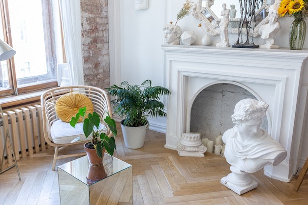 Bright workshop room for the creation and work of an architect and artist in a loft style with brick walls and parquet. the walls are decorated with examples of stucco.