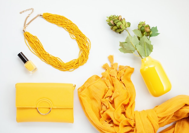 Bright yellow accessories for girls and women. Urban fashion, beauty blog concept