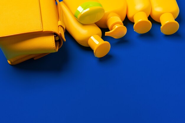 Bright yellow bottles of sunscreen product