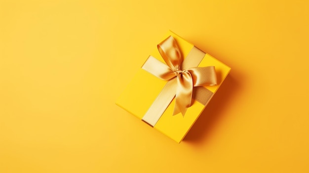 Bright yellow gift present box with ribbon