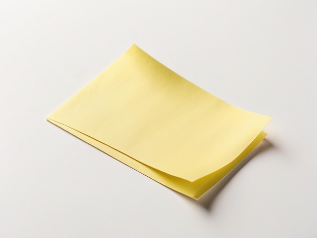 Bright yellow sticky note on plain white surface