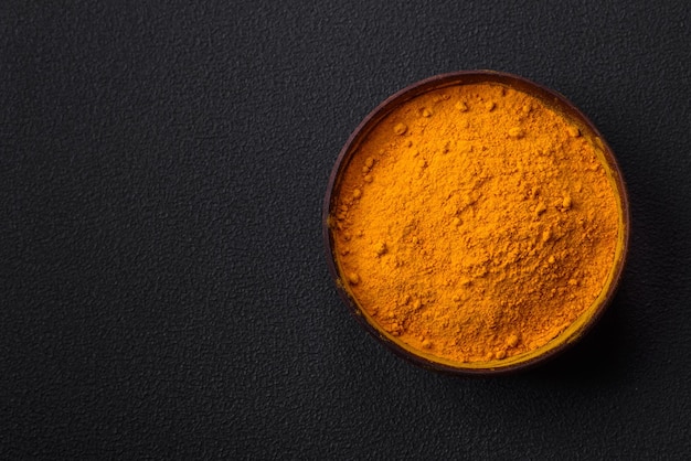 Bright yellow turmeric or curry spice for Asian food preparation