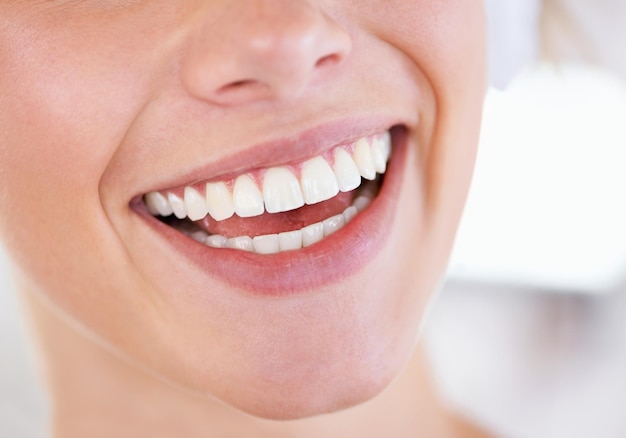 A brilliant display of pearly whites close up of a womans sparkling teeth