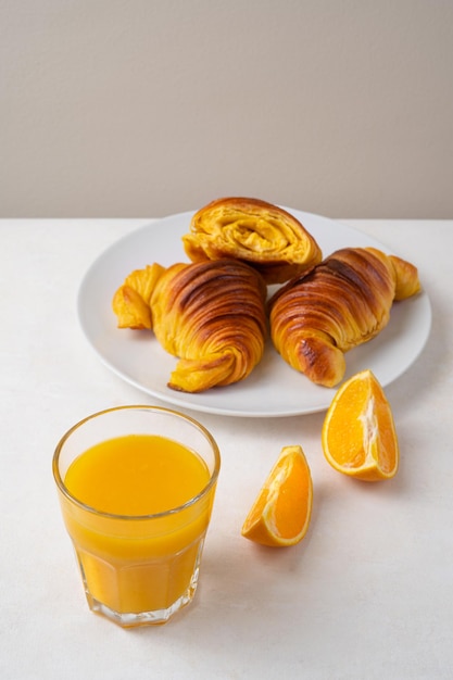 Brioche croissants with orange juice