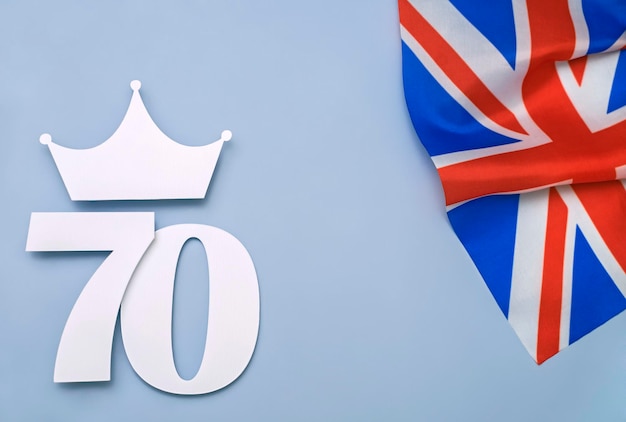 british style platinum anniversary background with number seventy crown and united kingdom uk flag