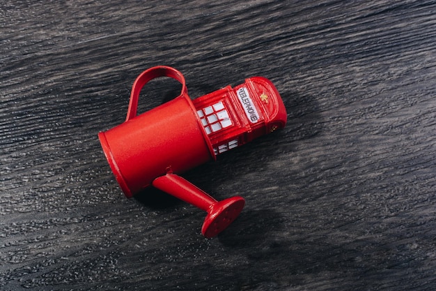 British style red phone booth model in watering can