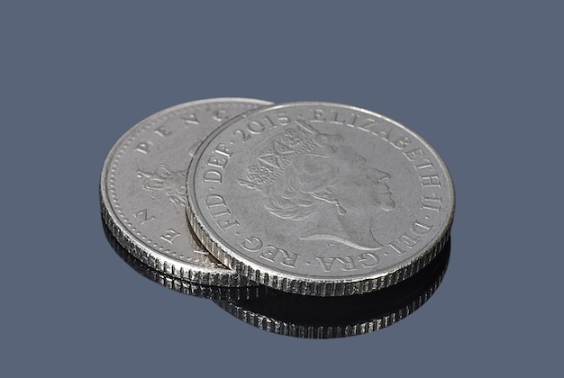 British ten pence coins on the dark background