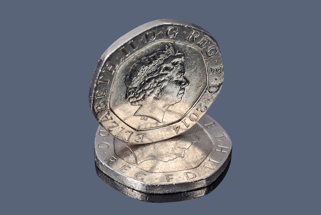 British twenty pence coins on the dark background