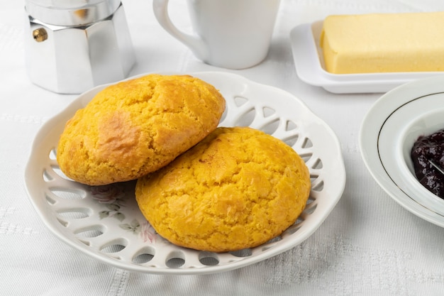 Broa, typical brazilian corn flour bread with coffee,jam and butter.