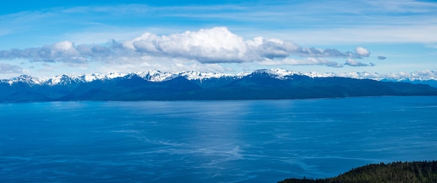 Broad panorama of the mountain range at icy strait point in alaska