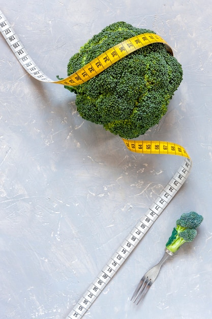 Broccoli and centimeter. Fresh egetable, concept for weight loss, diet, ketogenic diet, intermittent fasting