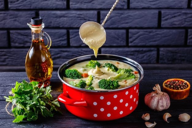 Broccoli cheese soup in a pot top view