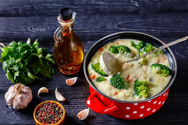 Broccoli cheese soup in a pot top view