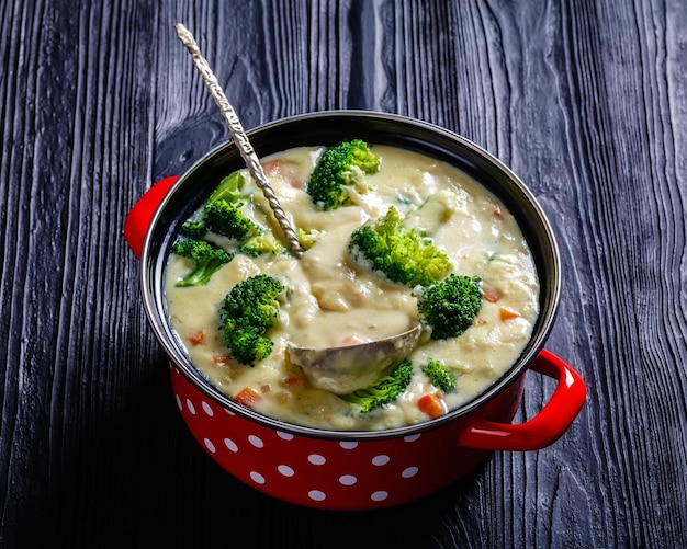 Broccoli cheese soup in a pot top view