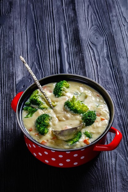 Broccoli cheese soup in a pot top view