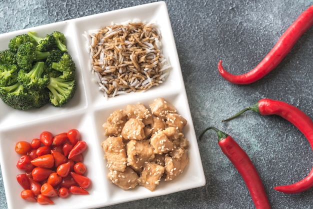 Broccoli and chicken stir-fry with rice and chili