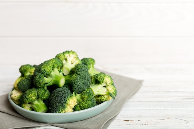 Broccoli of fresh green broccoli in bowl over coloredbackground. , close up. Fresh vegetable.