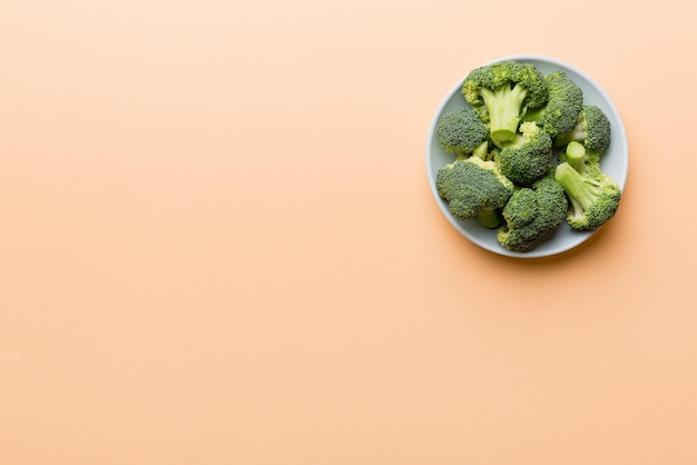 Broccoli of fresh green broccoli in bowl over coloredbackground  close up Fresh vegetable