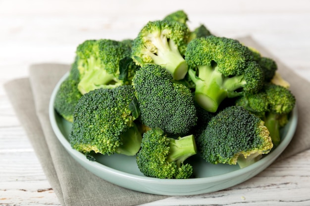 Broccoli of fresh green broccoli in bowl over coloredbackground close up Fresh vegetable