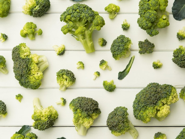 Broccoli pieces on white table pattern