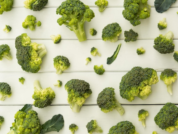 Broccoli pieces on white table pattern