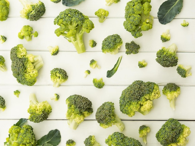 Broccoli pieces on white table pattern