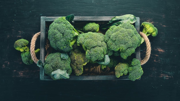 Broccoli in a Wooden box Healthy food On a wooden background Top view Copy space