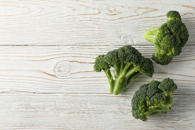 Broccoli on wooden surface. Healthy food