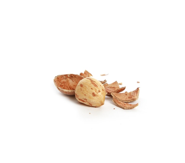 Broken almond isolated on a white background