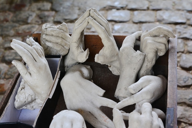 Broken and chopped stone hands from the statue