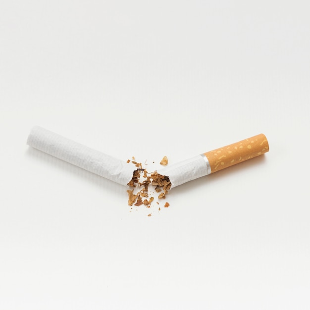 Broken cigarette isolated on white background