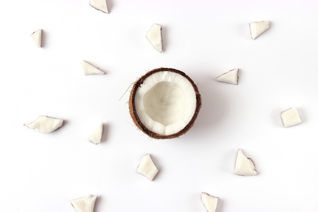 Broken coconut on a white background top view