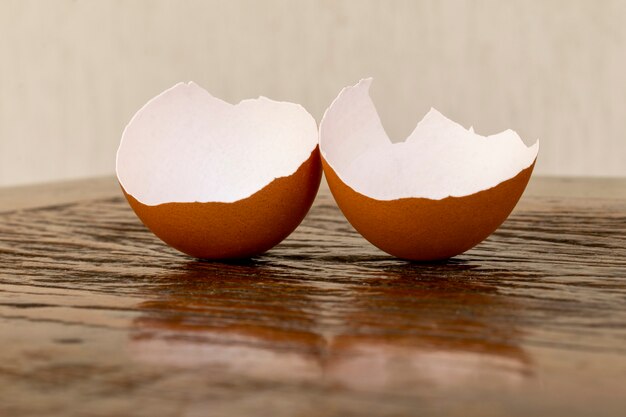 Broken eggshell on the rustic table.