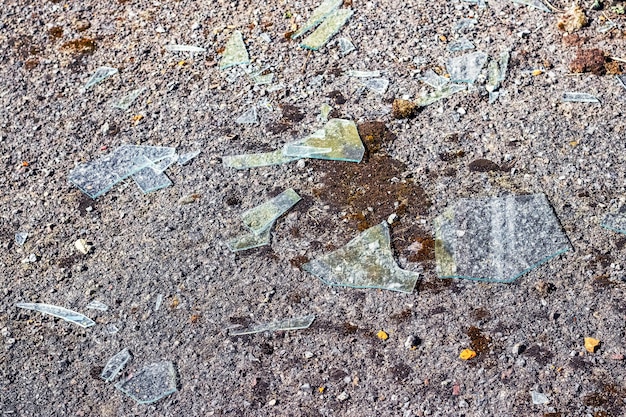 Broken glass on concrete as a result of hooliganism war or accident