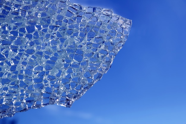 broken glass cracked over blue background