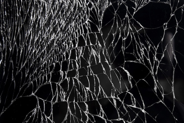 Broken glass display or cracked screen closeup An empty flat surface of black color