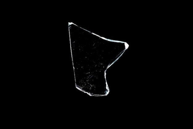 Photo broken glass in isolation on a black background. window damage. high quality photo