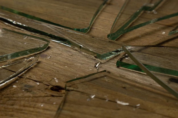 Broken glass on an old wooden floor concept of violence