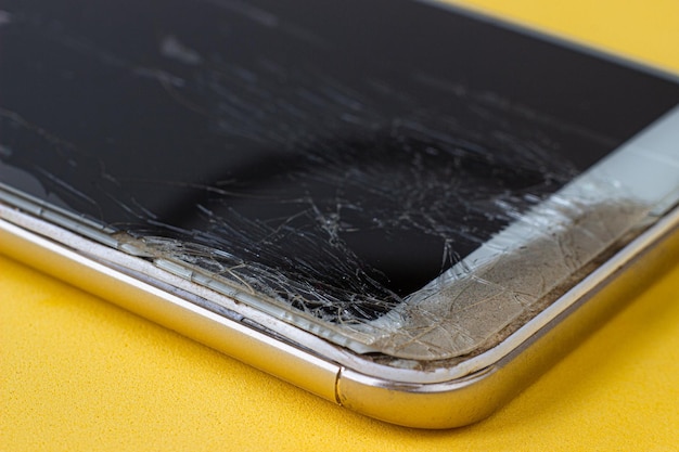 Photo broken glass texture with cracks abstract of smartphone broken screen due to shock