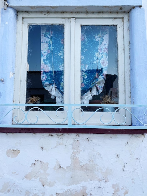 Broken glass window of old building