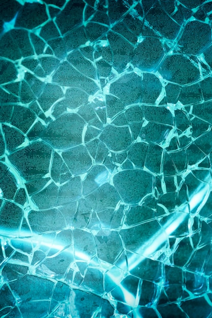 Foto vetro verde rotto con texture di sfondo di crepe