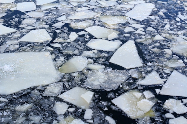 Broken ice on river surface in winter day