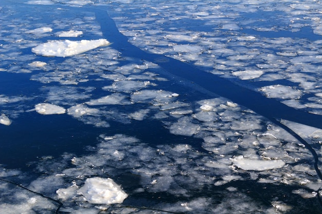 Broken ice on surface of river in winter