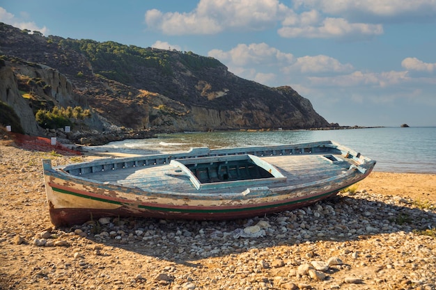 Broken migrant boat stranded on the beach