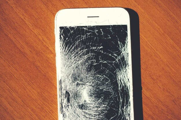 Broken phone on table