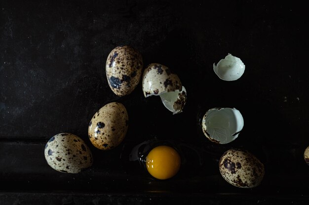 Photo broken quail egg with yolk fresh and natural farm produce